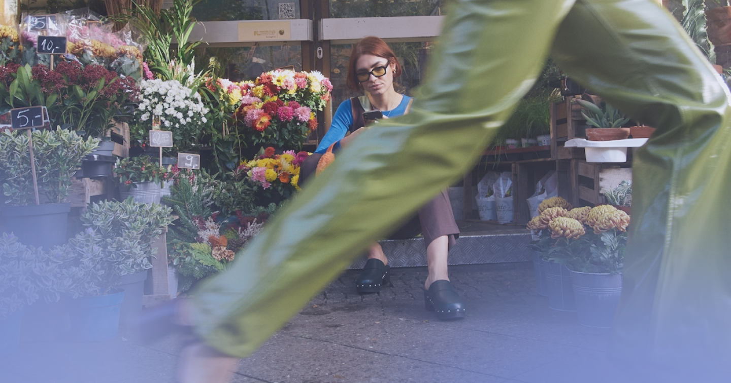 flowershop employee on mobile phone